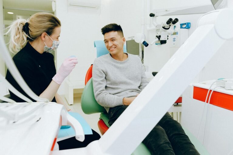 man sitting on dental chair